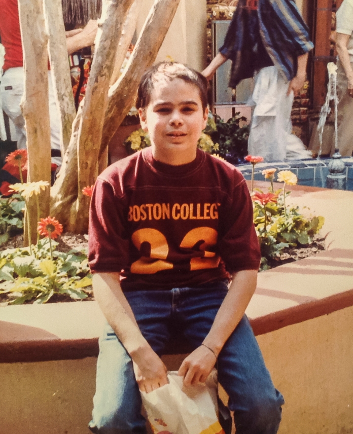 At Disney World in the winter of 1985; the scar from my surgery is visible and my hair has not grown completely back.